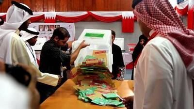 Members of the Bahraini voting committee start counting the ballots at a voting station in Isa city after the polls close.
