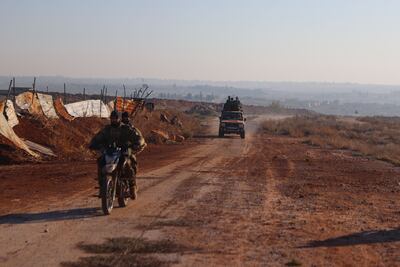 Fighters deploy to Atareb, Aleppo province as clashes between the Syrian army and Hayat Tahrir militants continues. AFP