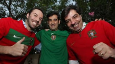 Portugal football fans Joao Cirne, Ernesto Barao and Luis Cirne at their home in Dubai.