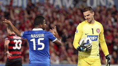 Saudi Arabia's Al Hilal's Nasser Al-Shamrani, left, has words with Western Sydney Wanderers' goalkeeper Ante Covic during their Asian Champions League Final match in Sydney, Australia, Saturday, Oct. 25, 2014. The Wonderers won the match 1-0. Rob Griffith / AP Photo