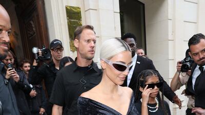 Kim Kardashian and Saint West depart the Balenciaga show in Paris. Getty Images