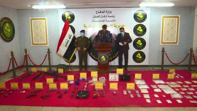 Authorities display the drugs and weapons seized in a raid in January. AP