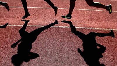 Athletes, left, compete barefoot in the Women’s 5000m event at the South African national championships at Coetzenburg Stadium, Stellenbosch, South Africa. The national championships provide a last opportunity for some athletes to qualify for the Rio Olympic Games. Nic Bothma / EPA