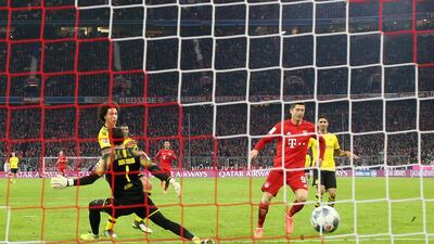 Robert Lewandowski scores his second and Bayern's third goal against Dortmund. Getty Images