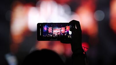 The Rose, a South Korean pop rock band, sang hits such as 'Sorry' during the concert. Pawan Singh / The National