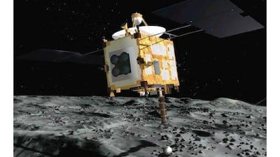 The Hayabusa probe collects surface samples after landing on an asteroid in an artist's rendering