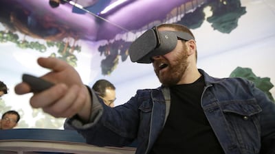 Dan Howley tries out the Google Daydream View virtual reality headset and controller. Daydream View will differ from other headsets, such as Samsung's Gear VR, in having a companion motion controller and compatibility with a wide range of phones, including Google's Pixel. Eric Risberg / AP