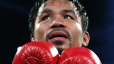 Manny Pacquiao’s says all his money has been locked up and he cannot help typhoon victims in Philippines that he had pledged to do so. Vincent Yu / AP Photo