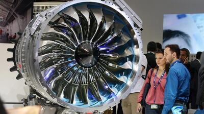 Two visitors watch a Safran made Silvercrest jet engine at the Paris Air Show. Remy de la Mauviniere AP Photo