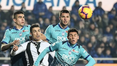 Juventus' Portuguese forward Cristiano Ronaldo (2ndL) eyes the ball being centred during the Italian Serie A football Match Atalanta Bergamo vs Juventus at the Atleti Azzurri d'Italia stadium in Bergamo. AFP