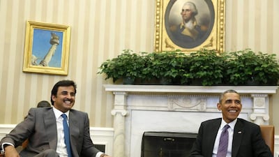 US president Barack Obama and the Emir of Qatar Sheikh Tamim bin Hamad Al Thani smile while in the Oval Office at the White House on February 24, 2015. Larry Downing/ ٍReuters