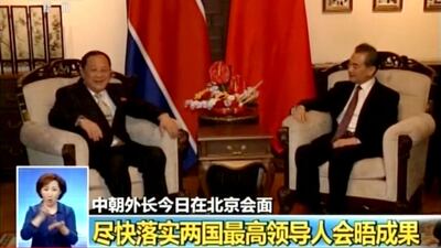 In this image taken from video footage by China's CCTV via AP Video, Chinese State Councilor and Foreign Minister Wang Yi, right, talks to North Korea Foreign Minister Ri Yong Ho during their meeting in Beijing. CCTV via AP Video