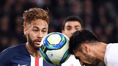 Brazilian forward Neymar (L) competes for the ball with with Lille's Turkish defender Zeki Celik. AFP