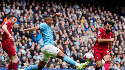 Liverpool's Mohamed Salah, right, scores his side's opening goal during the English Premier League soccer match between Manchester City and Liverpool at Etihad stadium in Manchester, England, Saturday, April 1, 2023. (AP Photo / Jon Super)