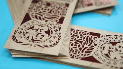 Envelopes used for giving out lucky money, known as "Lai See" in Cantonese and "Hong Bao" in Mandarin, are arranged for a photograph at the Yau Kee Printing Group facility in Hong Kong, China. Bloomberg