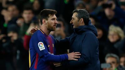 There will be league title celebrations for Lionel Messi, left, and Ernesto Valverde, if Barcelona beat Levante on Saturday. AP Photo