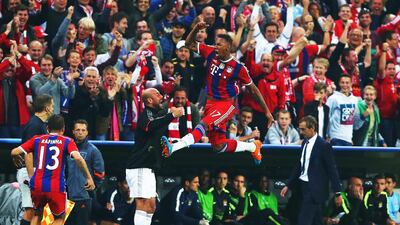 Jerome Boateng of Bayern Munich jumps as he celebrates scoring the winning goal against Manchester City for a 1-0 Champions League group stage victory on Wednesday night in Munich. Alexander Hassenstein / Bongarts / Getty Images / September 17, 2014