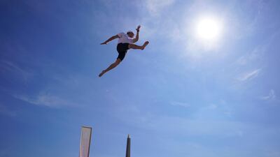 A man jumps as he takes part in the "Journee Olympique" ("Olympic day") in Paris. A total of thirty Olympic and paralympic sports will be presented on Place de la Concorde in Paris. APF