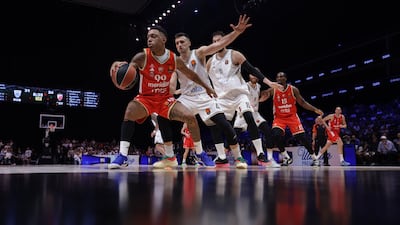 Crvena Zvezda's Yago Dos Santos, left, and Aleksa Avramovic of Dubai Basketball in action. EPA