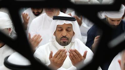 Worshippers travelled to the mosque to pray on the first day of Eid Al Fitr. Pawan Singh / The National