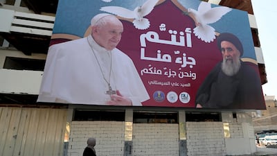A billboard with 'You are a part of us and we are a part of you' in Arabic hangs on a street in Baghdad, Iraq, heralding the landmark meeting between Pope Francis and Grand Ayatollah Ali Al Sistani. AP/Khalid Mohammed