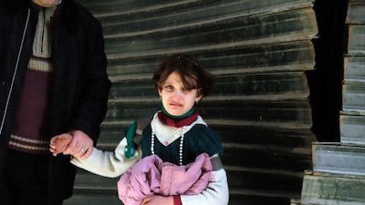 A Syrian girl cries following an explosion in Aleppo. As well as witnessing atrocities, children are being deliberately targeted for abuse, or to be used near front lines as porters or human shields.