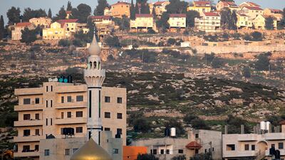 The Palestinian village of Azmut, east of Nablus, in the occupied West Bank, with the Israeli settlement of Alon Moreh in the background. AFP