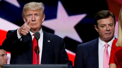 Donald Trump gives a thumbs up as his campaign manager Paul Manafort looks on during Trump's walk through at the Republican National Convention in Cleveland, U.S. in 2016. Reuters