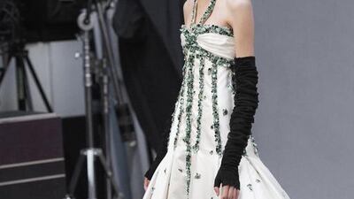 For evening wear, Lagerfeld took his cues from 19th-century English author and illustrator Aubrey Beardsley. Beardsley’s signature black-and-white illustrations, always set against a white background, were translated into high waists, voluminous cuts, intricate embroidery and beading. Olivier Saillant