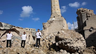 Muslims pray amid the rubble and ruins in a destroyed part of Gaza city's historic Omari Mosque on the first day of Ramadan. AFP
