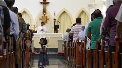 Sri Lankan Catholic devotees pray during a mass at the St. Theresa's church as the Catholic churches hold services again after the Easter attacks in Colombo on May 12, 2019. Thousands of Catholics attended mass in Sri Lanka's capital Colombo on May 12 amid tight security to prevent a repeat of Easter bomb attacks that killed 258 people. / AFP / LAKRUWAN WANNIARACHCHI