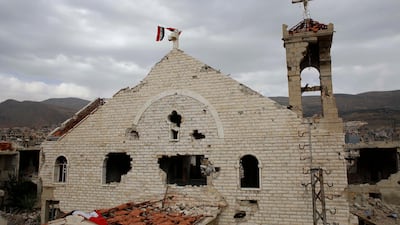 A Syrian flag raised over the damaged Saint Mary Roman Orthodox church at the mountain resort town of Zabadani in the Damascus countryside, Syria. The Qatar-based Syrian Network for Human Rights, a Syrian war monitor associated with the opposition said in its report that over 120 Christian places of worship have been damaged or destroyed by all sides in the country’s eight-year conflict. AP