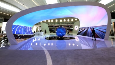 Masdar's stand at Abu Dhabi Sustainability Week. The company's renewables projects span from the Middle East and Central Asia to Europe and the US. Victor Besa / The National