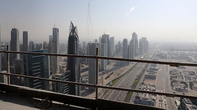 View of Business Bay and the Sheikh Zayed Road towards Abu Dhabi from the under construction Wasl Tower. Pawan Singh / The National