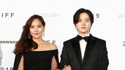 Actress Yoo Jin and actor Kim Ho-sung arrive for the Opening Ceremony of the 24th Busan International Film Festival. Getty Images