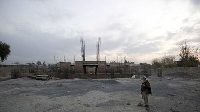 Mohammed Zahir stands in front of the tomb of Khan Abdul Ghaffar Khan, a pioneer of Pashtun rights, in Jalalabad, eastern Afghanistan.