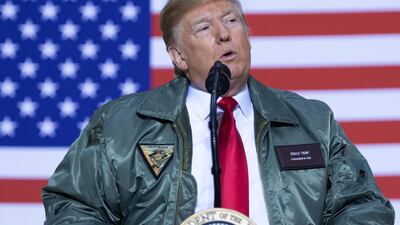 US President Donald Trump speaks to US military during an unannounced trip to Al Asad Air Base in Iraq. Saul Loeb / AFP