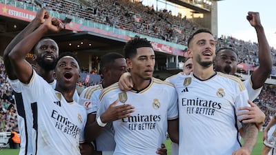 Real Madrid's Jude Bellingham, centre, celebrates with Antonio Rudiger, Vinicius Junior and Joselu after scoring his team's second goal. AFP