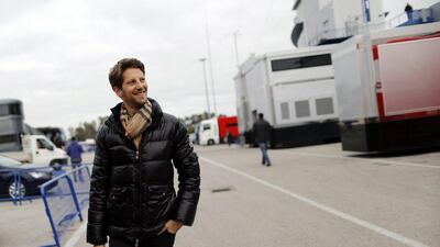 Lotus driver Romain Grosjean arrives at the paddock in Jerez, Spain for F1 winter testing on Monday. Marcelo del Pozo / Reuters