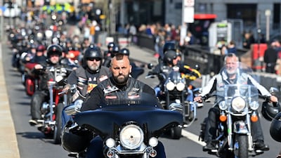 Members ride through London in March 2022. AFP