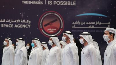 (R-L) Sheikh Mansour bin Zayed, Sheikh Hamdan bin Mohammed, Sheikh Mohamed bin Zayed, Sheikh Mohammed bin Rashid, Sheikh Hamdan bin Rashid, Sheikh Saif bin Zayed and Sheikh Abdullah bin Zayed, Minister of Foreign Affairs and International Co-operation, stand for the UAE national anthem during a ceremony to honour the Hope Probe team, at Qasr Al Watan on July 31. Hamad Al Kaabi / Ministry of Presidential Affairs
