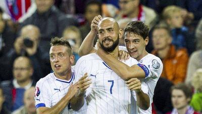 Italy's Simone Zaza, centre, celebrates with his teammates after scoring against Norway during their Euro 2016 qualifier on Tuesday. Vegard Wivestad Grott / NTB Scanpix / Reuters / September 9, 2014