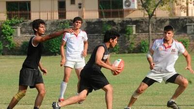 The Afghanistan rugby team, in white, are the newest rugby nation in the world.