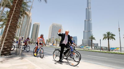 Boris Johnson, mayor of London, rides a bicycle with the RIDE Shop team outside Pavilion Downtown in Dubai. Sarah Dea/The National