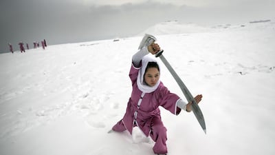 A Shaolin martial arts student practices on a hilltop in Kabul on January 25, 2017. Massoud Hossaini / AP Photos