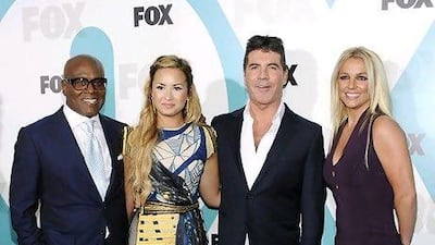The X Factor US judges, from left, LA Reid, Demi Lovato, Simon Cowell and Britney Spears. Evan Agostini / AP Photo