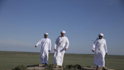 As the convoy moves on, a first-year female falcon feeds on a freshly-killed pigeon, shortly after she’s been released into the wild by falconers in Aktau, Kazakhstan. Silvia Razgova / The National