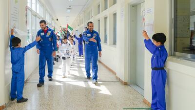 The Emirates' space pioneers receive a heroes' welcome from pupils. More UAE space missions are planned