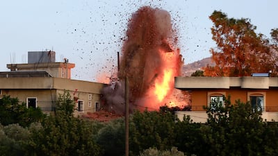 Smoke, flames and debris following an Israeli air strike in the village of Kfar Tebnit, southern Lebanon. Israel's military claimed it struck Hezbollah military targets, escalating tensions along the border. EPA