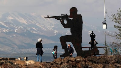 Israeli tourists visit the Syrian border in the Golan Heights. EPA